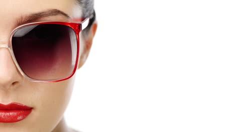 Woman-wearing-red-sunglasses-portrait-close-up-half-face-character-series-isolated-on-pure-white-background